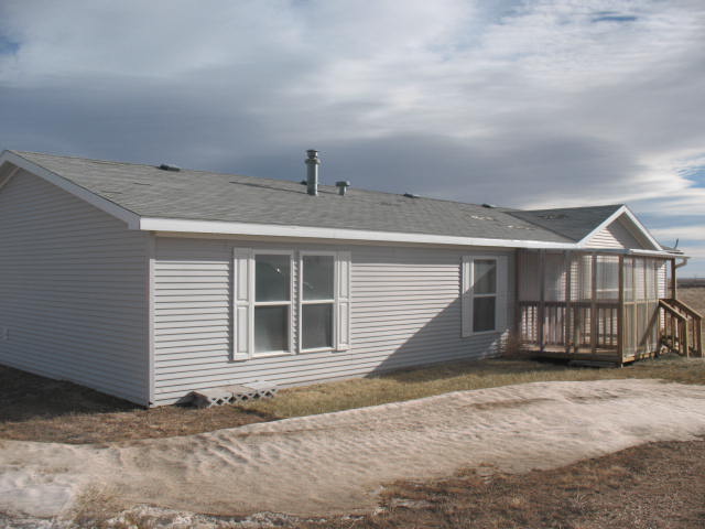 Picture of the front of the home at 5296 Road 208, Carpenter, WY 82054 - Home for Sale